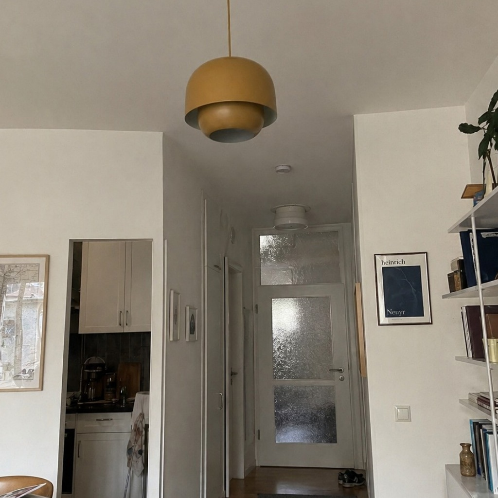 Fotorecensie met bronzen Clinco hanglamp in hal